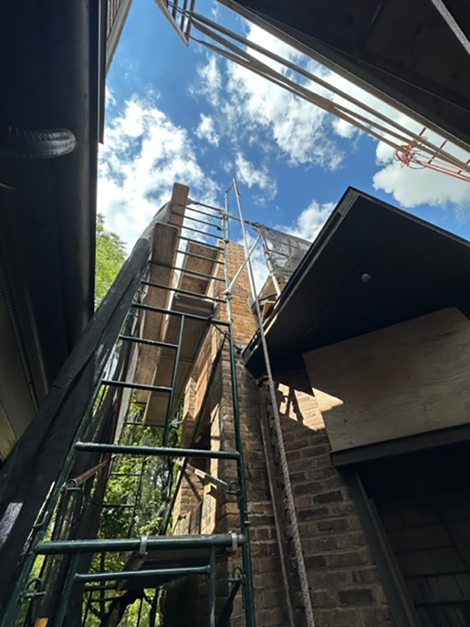 Temporary scaffolding around one of the chimneys.