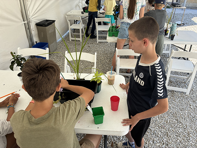 Campers collaborate and brainstorm the layout of their planters.